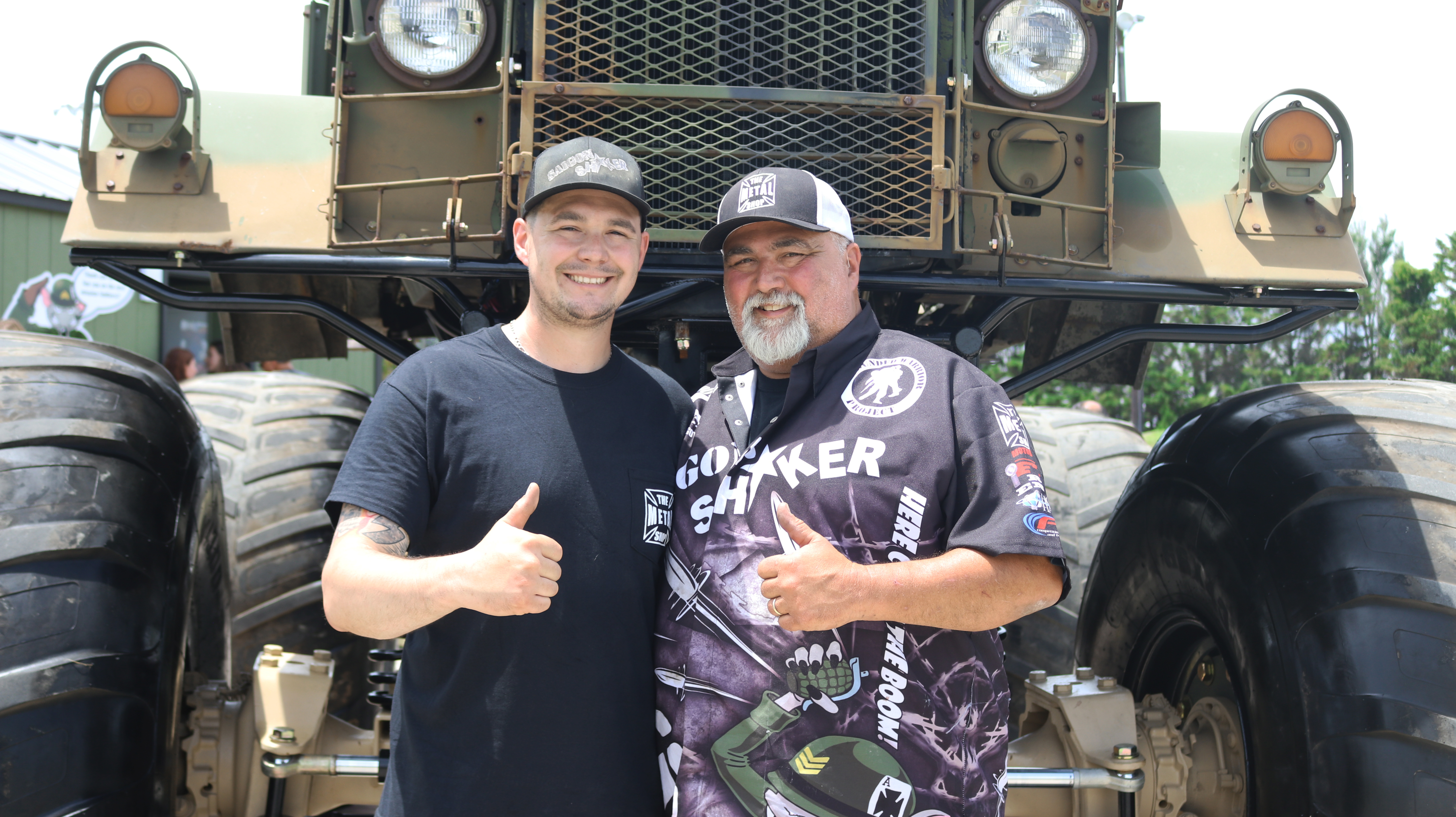 Father and Son pictured in front of the monster truck 