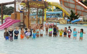 group of kids standing in the water at Splash Mountain Water Park