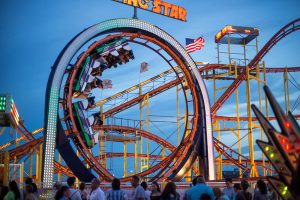 Loop on the looping star coaster with a car of people going upside down